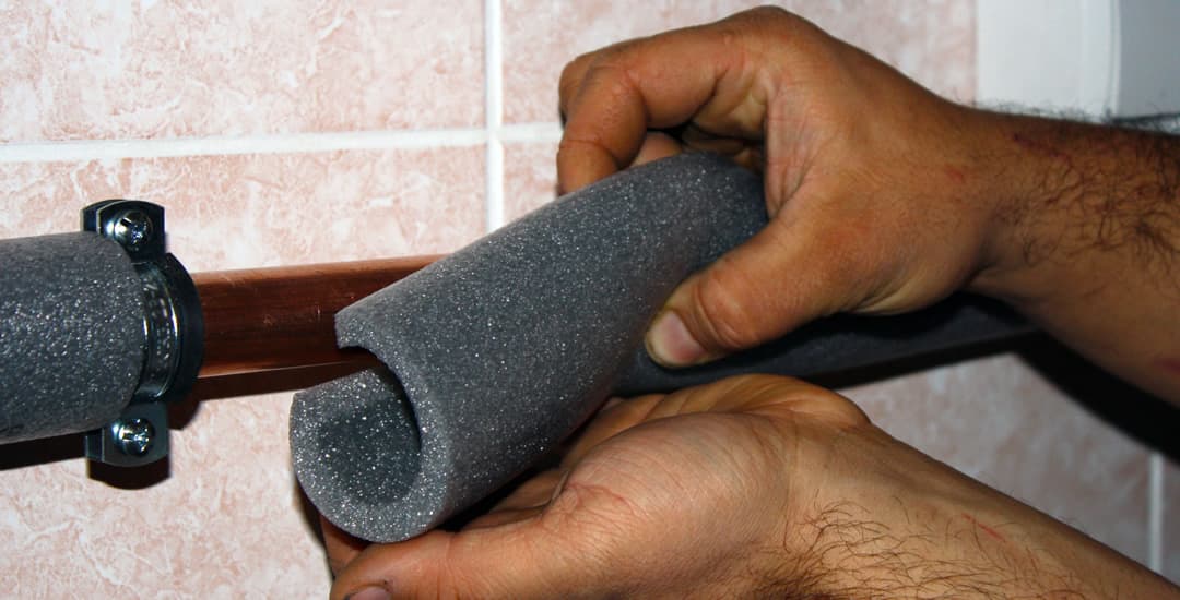 Pipe insulation being installed