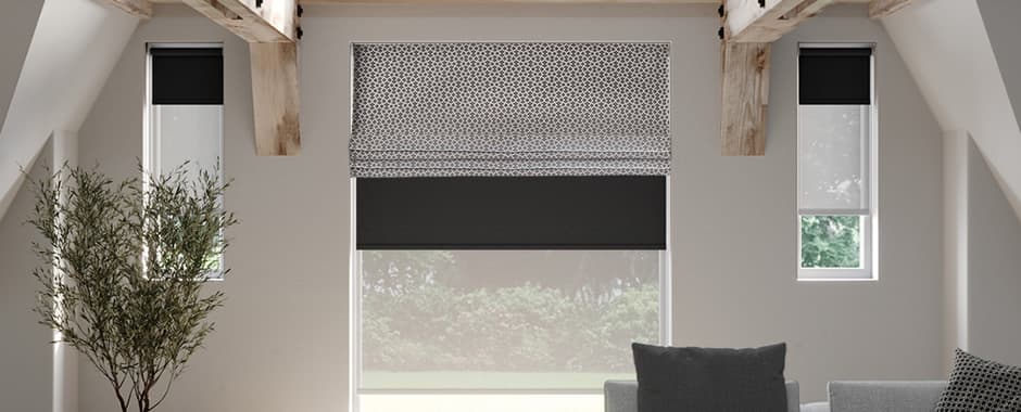 Roman blind fitted over a roller blind
