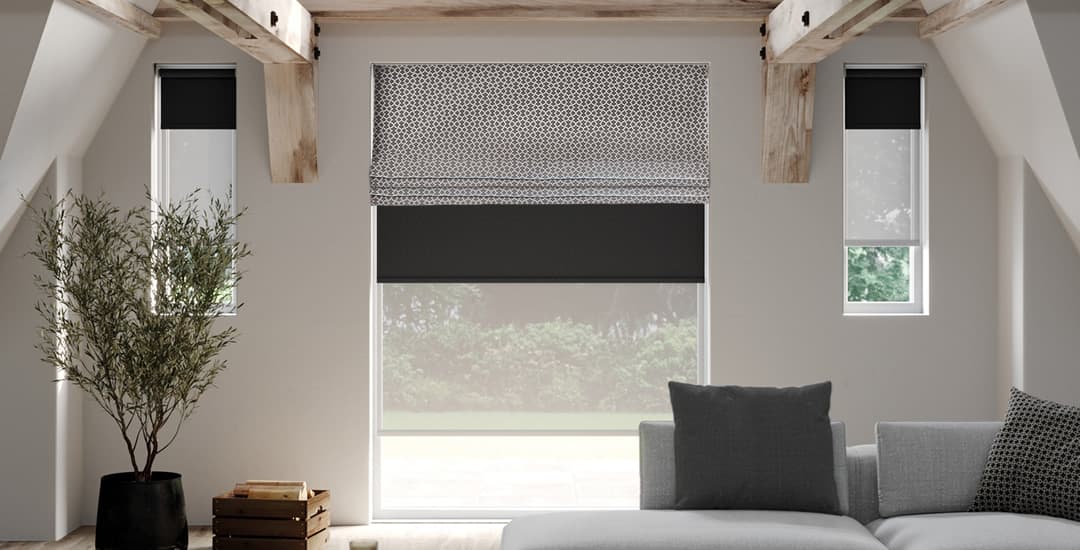 Roman blind fitted over a roller blind