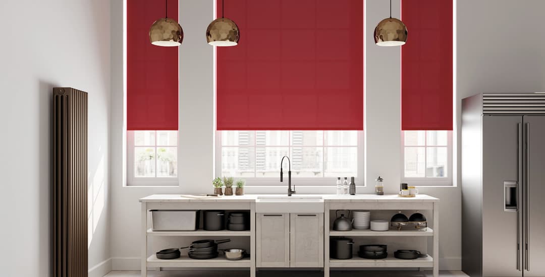 Red roller blinds in contemporary kitchen