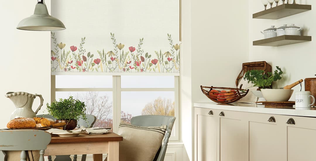 Wild garden floral patterned roller blinds in cream kitchen
