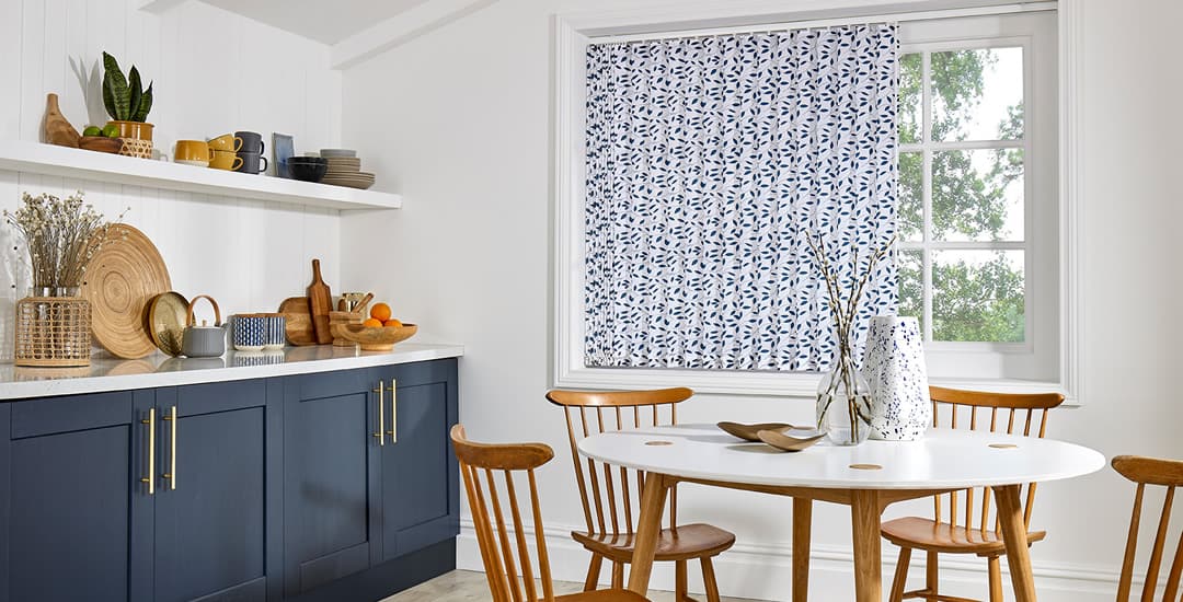 Blue and white leaves patterned vertical blinds in modern kitchen