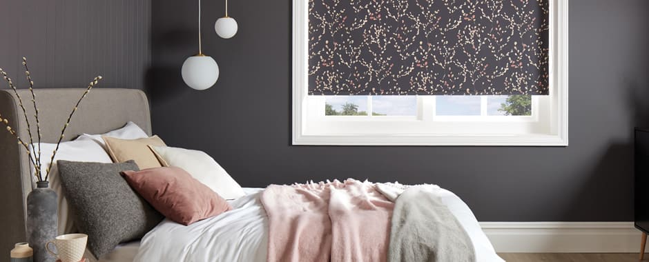 Dark willow patterned roller blinds in bedroom