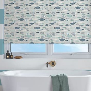 Fish patterned roller blinds in blue and white striped bathroom