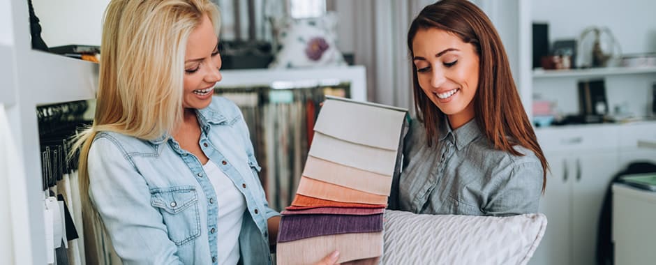 Interior designer showing client fabrics