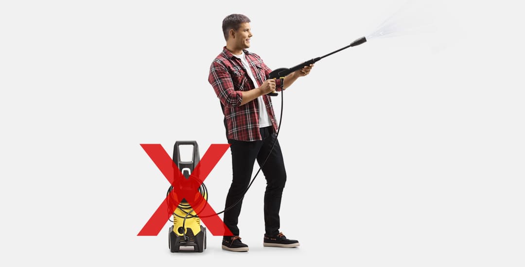 Man holding a pressure washer