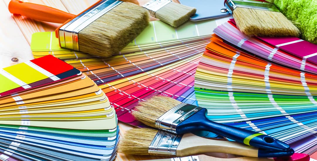 Paint colour cards and paintbrushes 