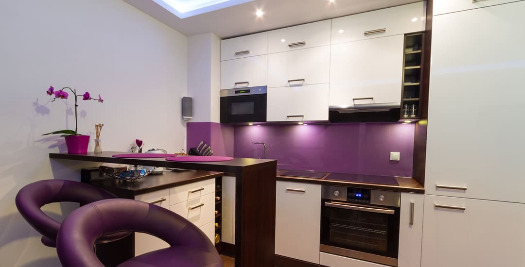 Small purple and white kitchen