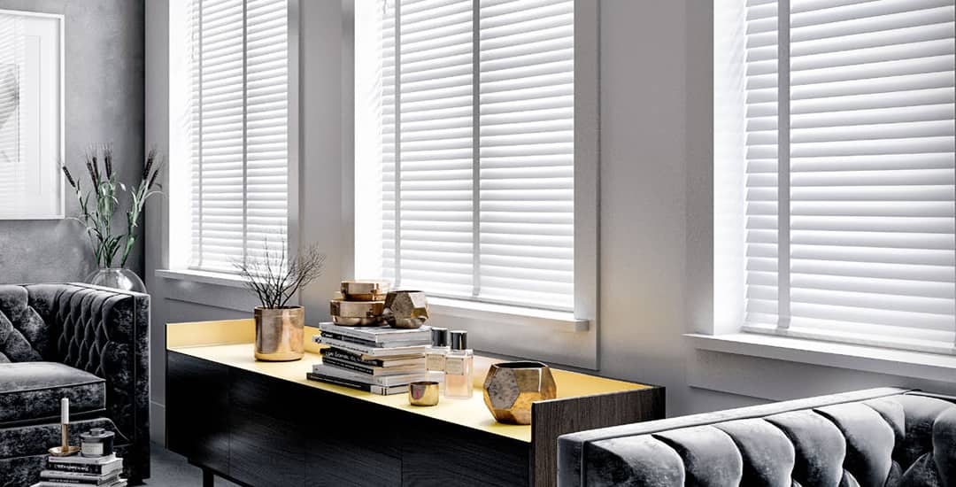 White wooden blinds with tapes in lounge