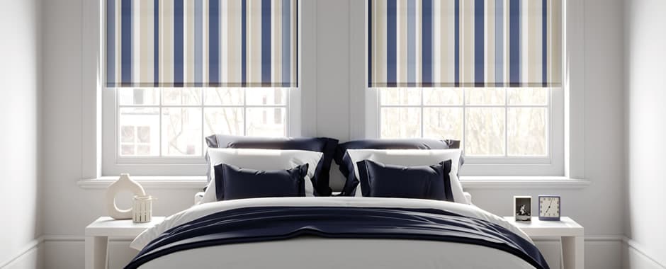 Blue beige and white vertical striped roller blinds in bedroom