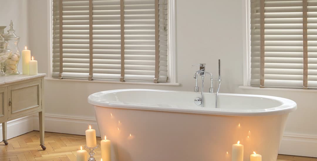 faux wood blinds in bathroom with candles