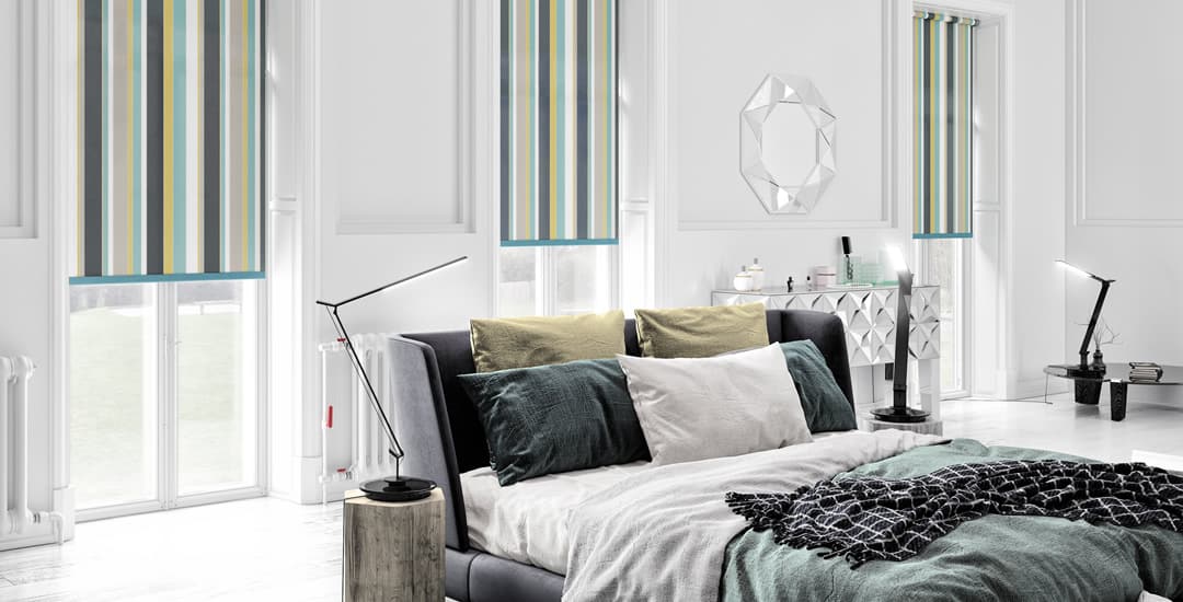 Green yellow and grey striped roller blinds in bedroom