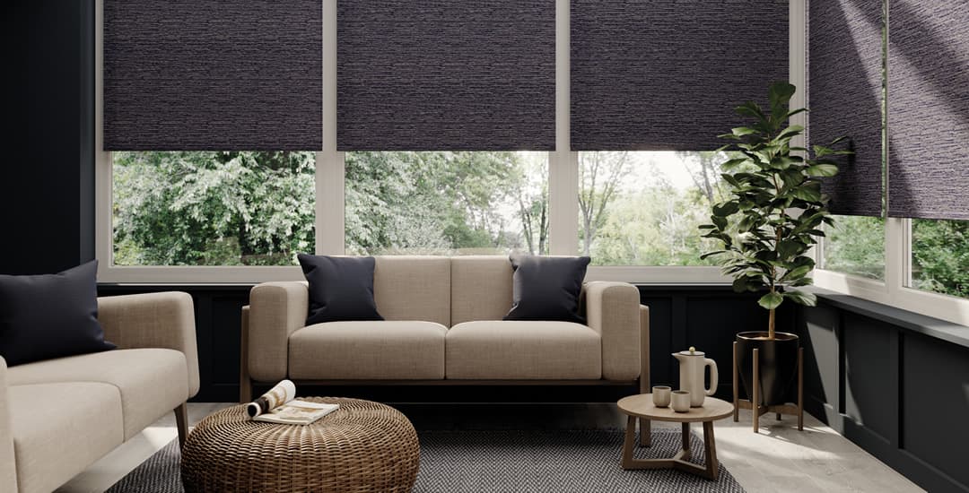 Luxury grey textured thermal roller blinds in garden room