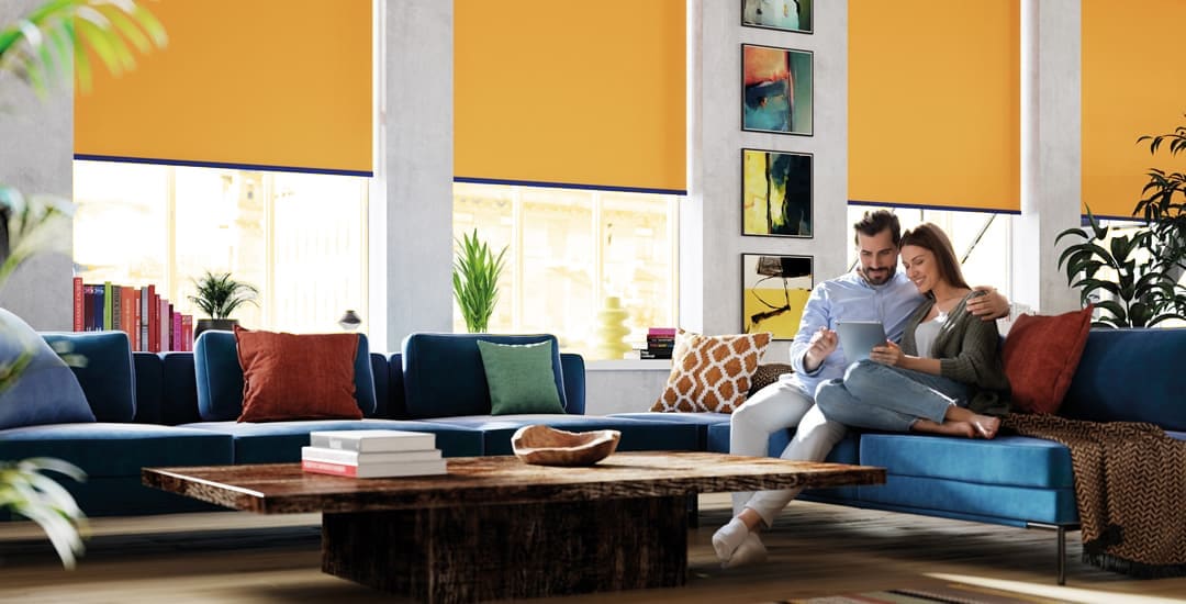 Sunny contemporary living space with yellow roller blinds