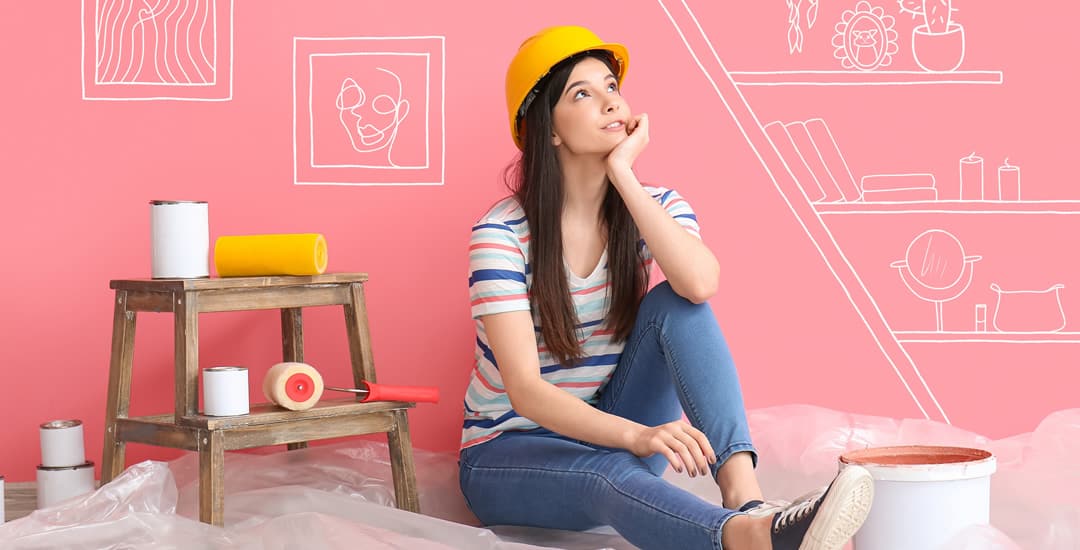 Young woman planning the decoration of a room