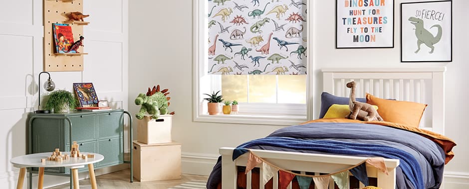 Dinosaurs patterned blackout roller blinds in colourful children’s bedroom
