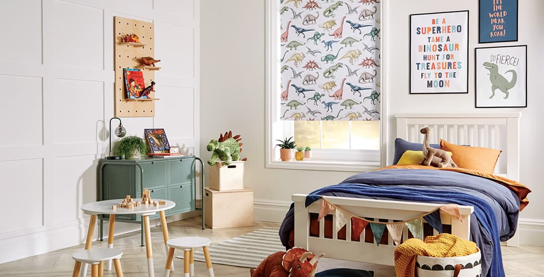 Dinosaurs patterned blackout roller blinds in colourful children’s bedroom