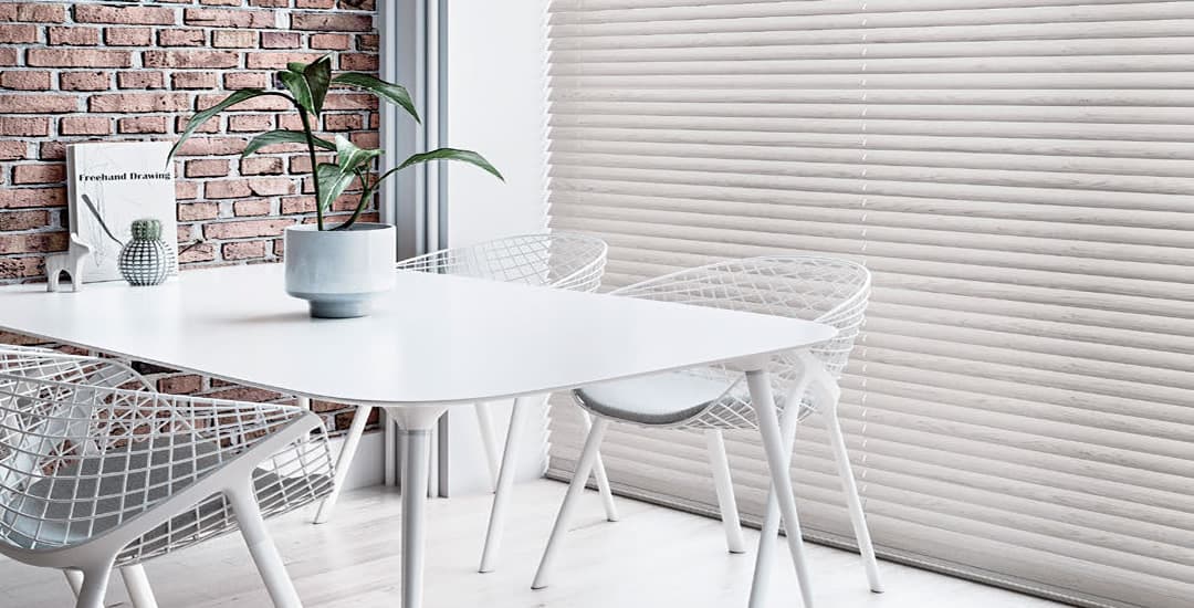 Large faux wood blinds in dining area