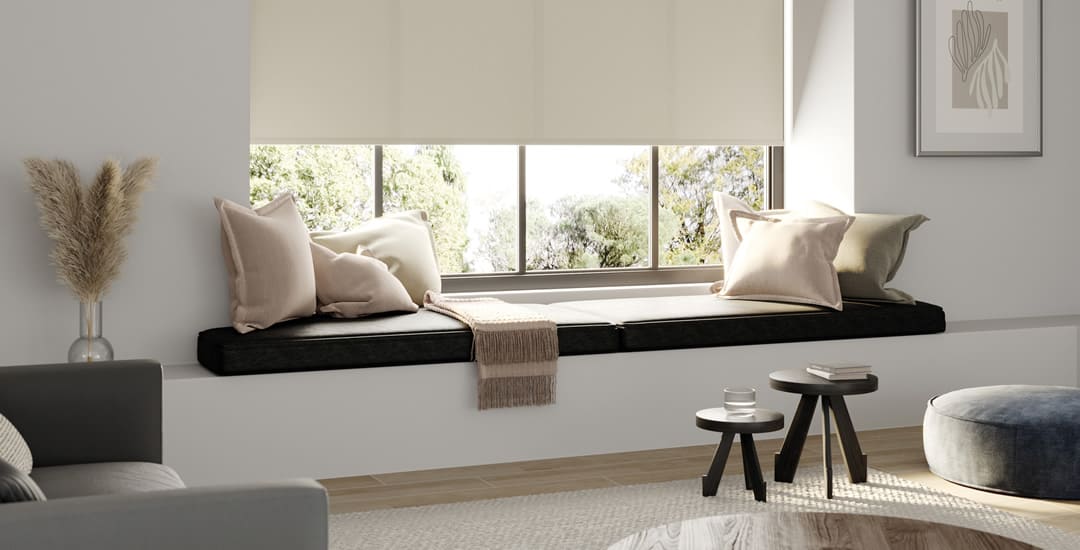 Luxury beige roller blind in neutrally painted room with wood floor