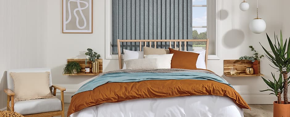 Luxury grey vertical blinds in cosy bedroom
