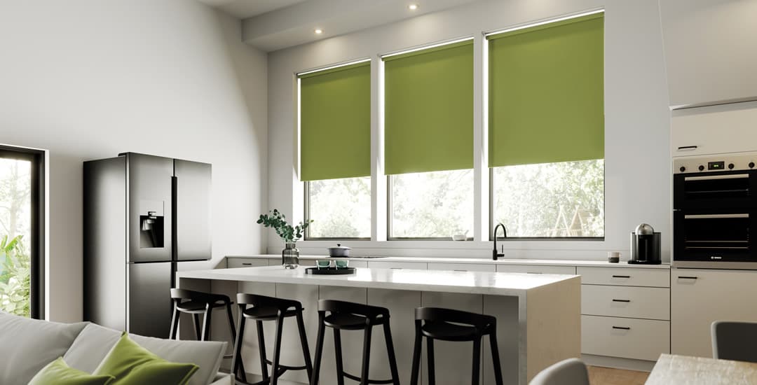 Soft moss green roller blinds in luxury modern kitchen