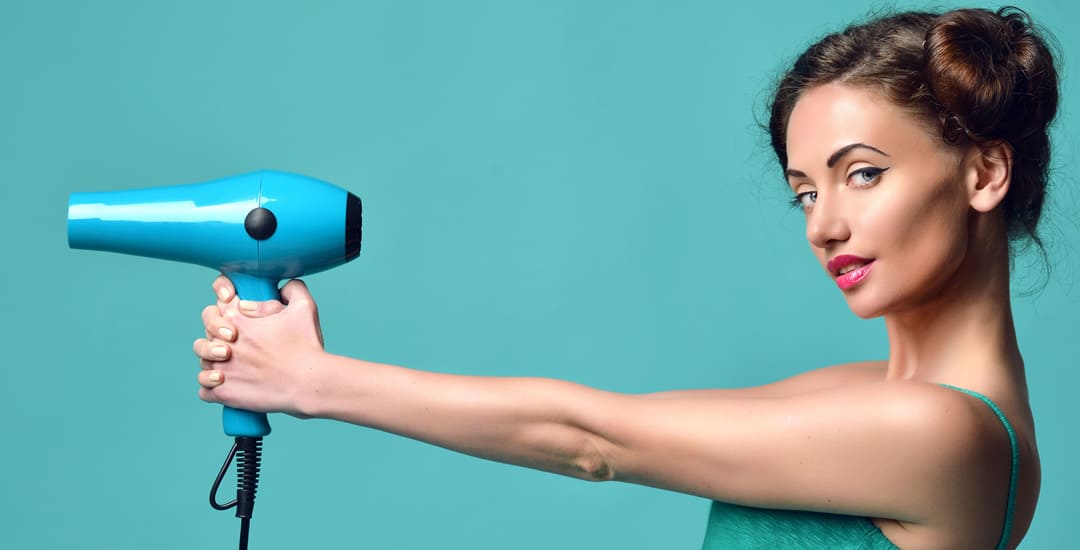 Woman holding hairdryer 