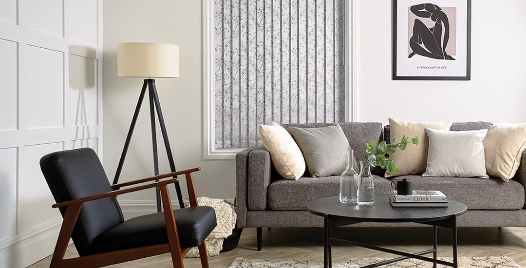 Closed silver grey vertical blinds in living room