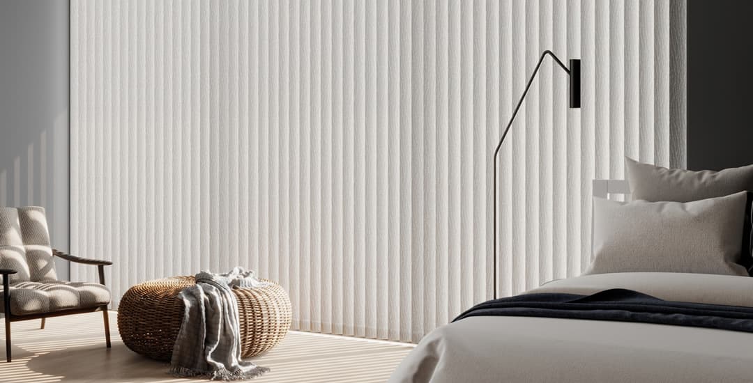 Cream thermal vertical blinds in bedroom