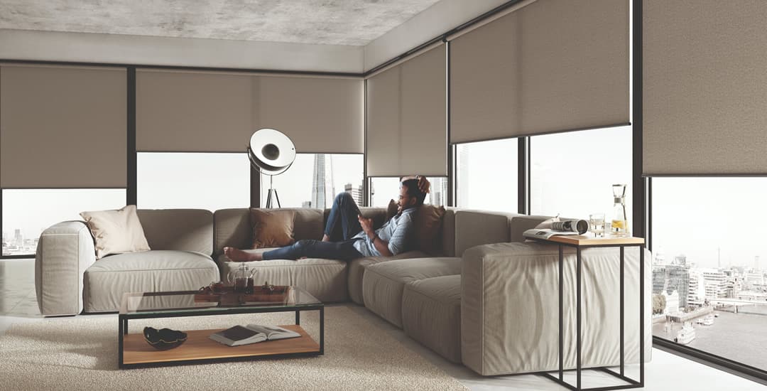 Large brown textured roller blinds in modern apartment