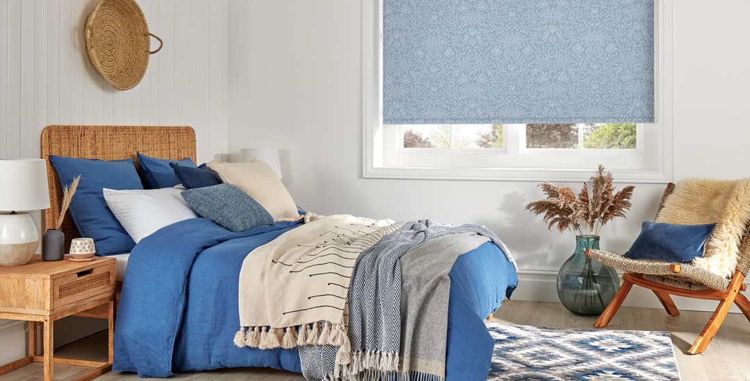 Vintage blue patterned blackout roller blinds in bedroom