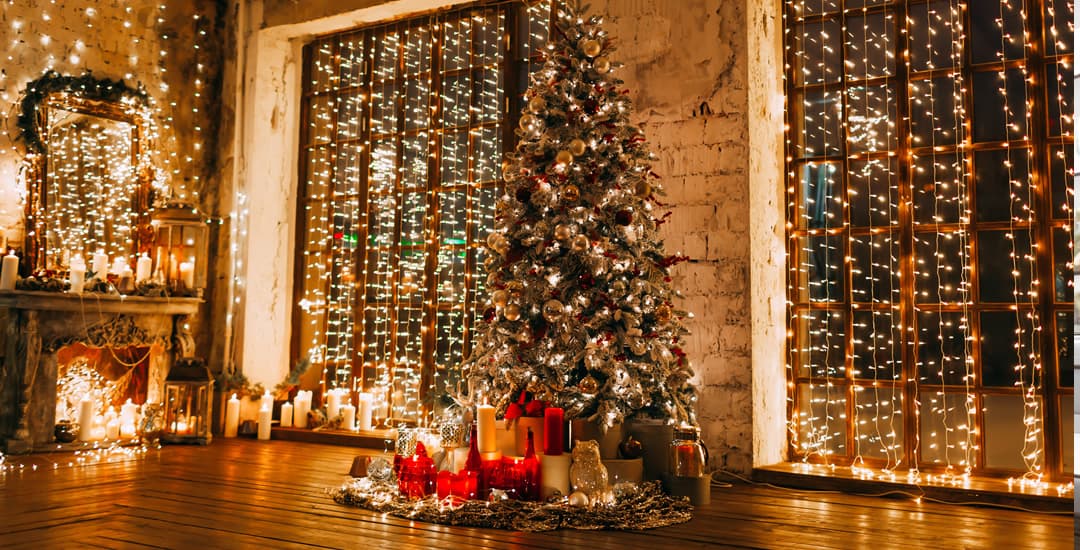 Christmas lights in window of cosy lounge