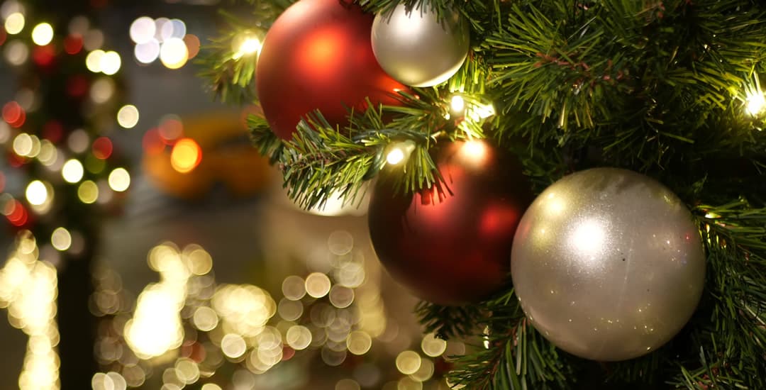 Closeup of festively decorated Christmas tree with baubles