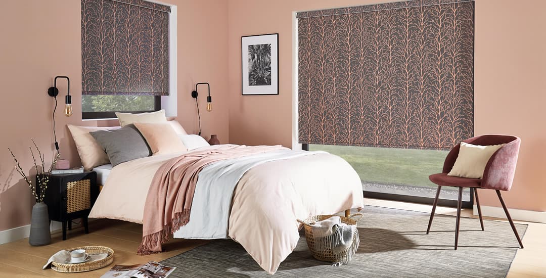 Copper and anthracite patterned blackout roller blinds in bedroom