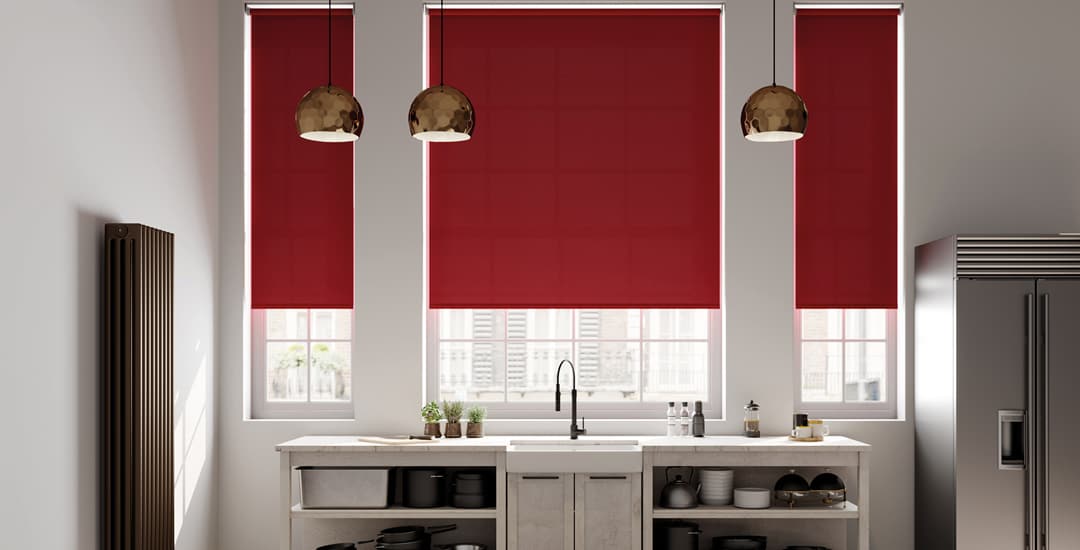 Red roller blinds in modern kitchen