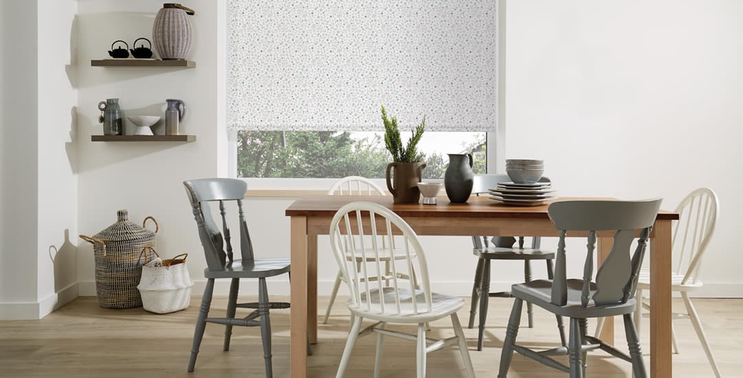 Small flowers patterned roller blinds in dining room