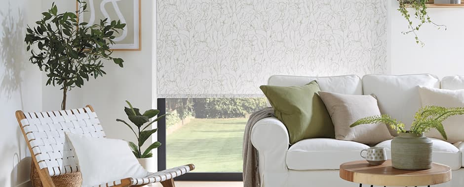 Green and white sweet peas patterned roller blinds in lounge