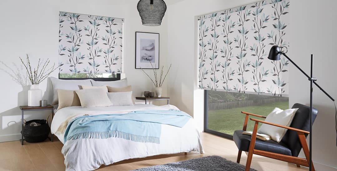 Lily patterned blackout roller blinds in bedroom