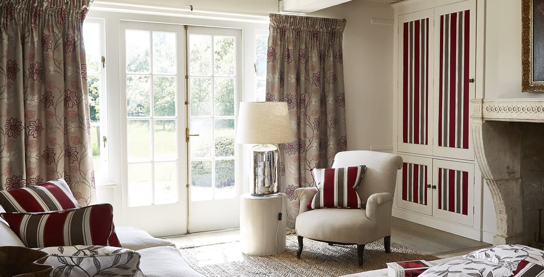 Luxury brown floral curtains over French doors in a cottage