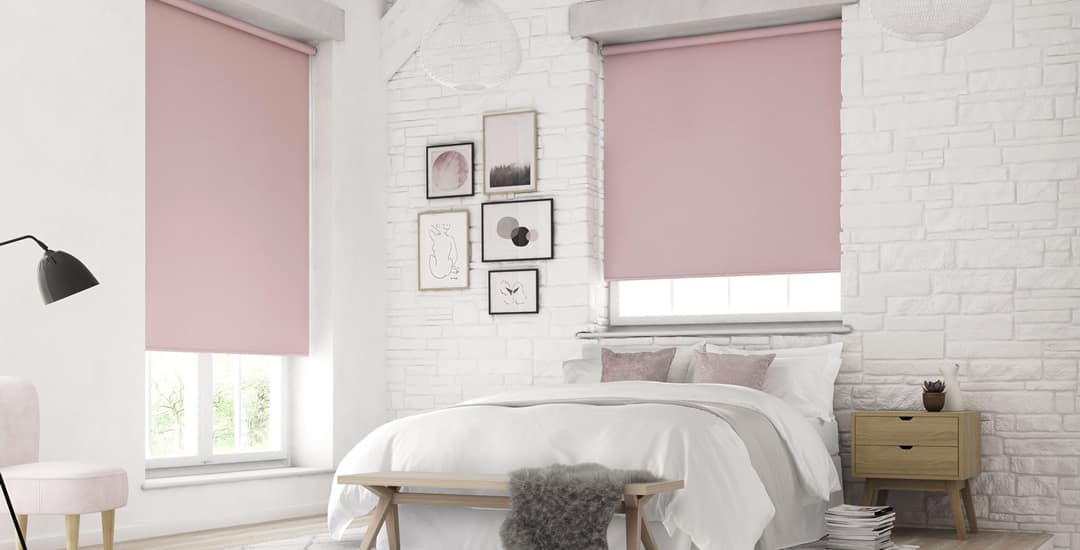 Pink blackout blinds in white brick bedroom