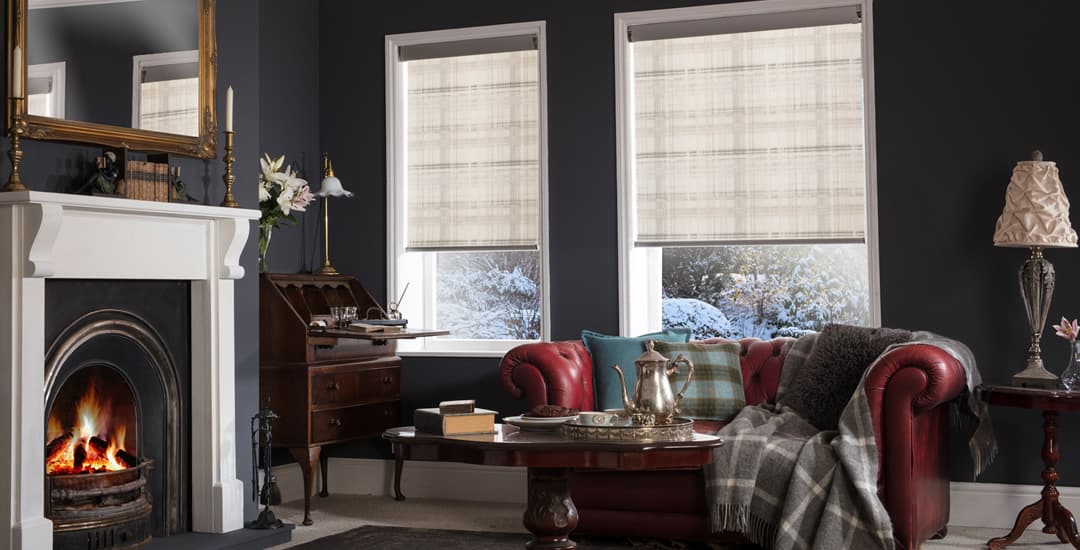 Beige patterned roller blinds in a traditional drawing room