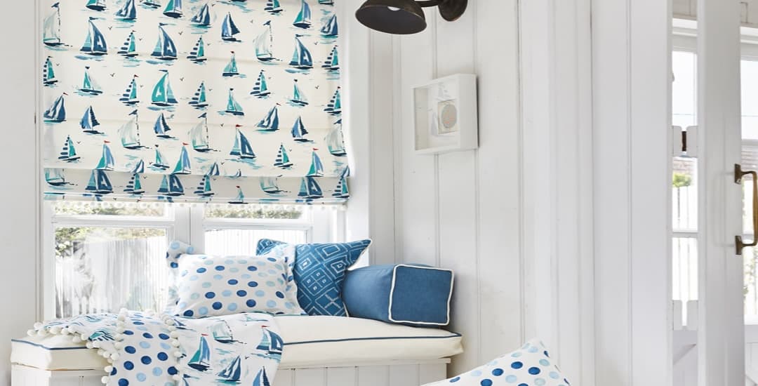 Blue boat patterned luxury roman blinds in bright white room