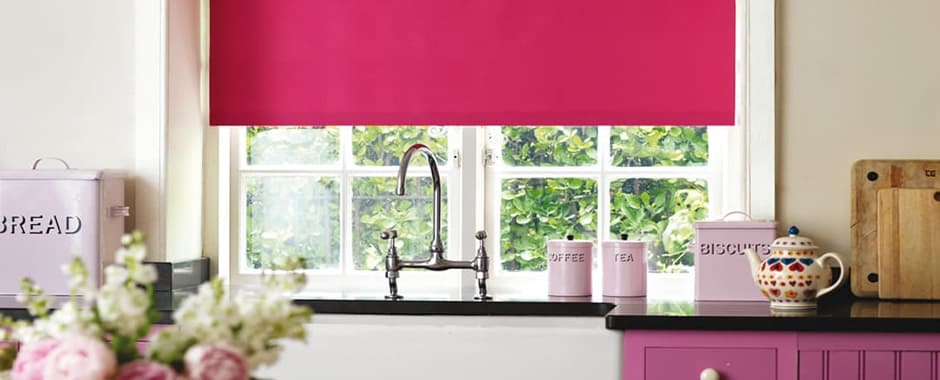 Colourful waterproof vinyl roller blinds above a Belfast kitchen sink