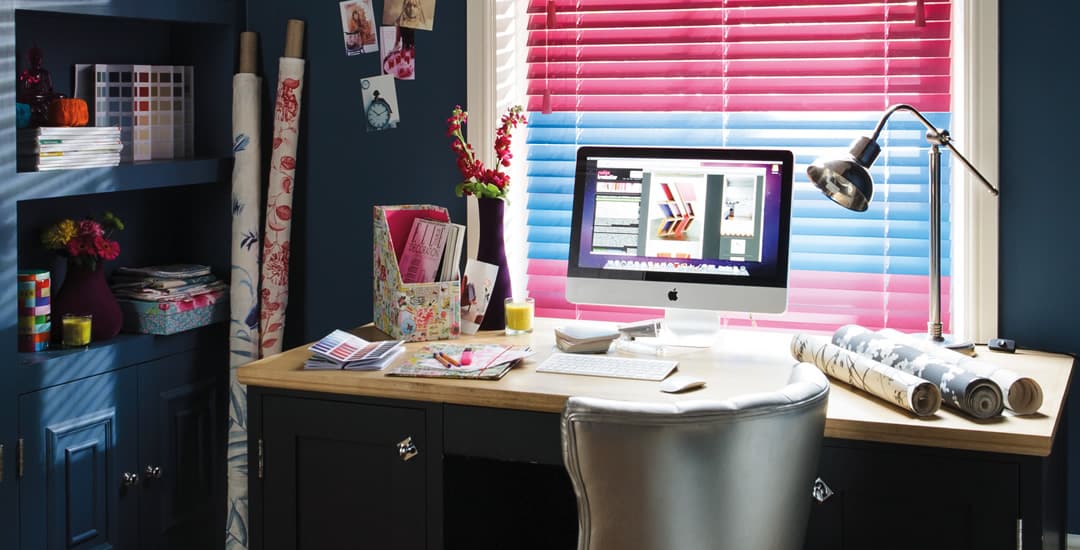 Colourful wooden Venetian blinds in dark blue home study