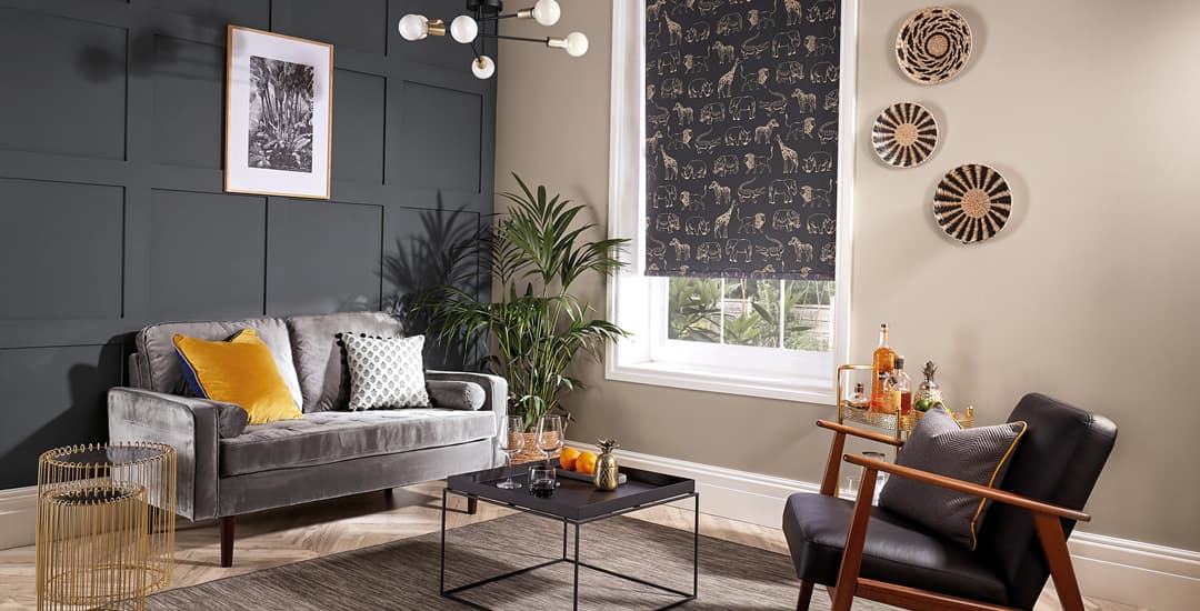 Black gold safari animals roller blinds in dark wood panelled lounge