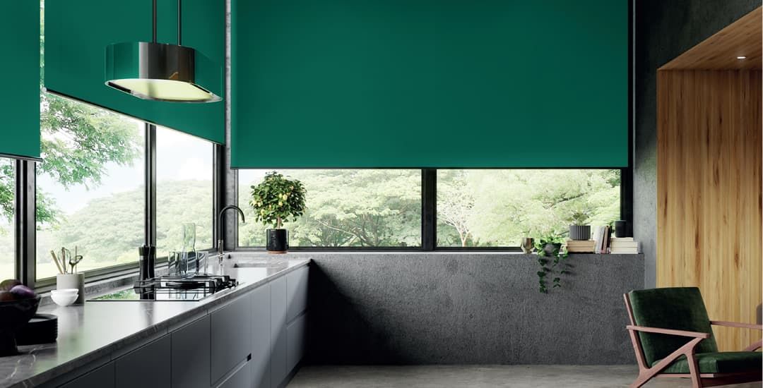 Extra wide green roller blinds in luxury modern kitchen
