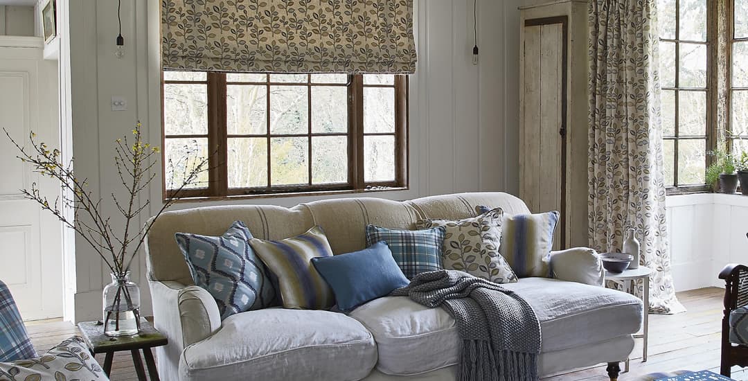 Luxury floral roman blinds in traditional farmhouse drawing room