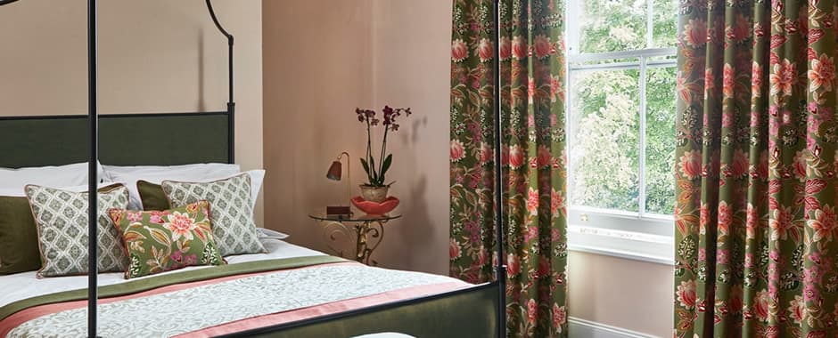 Luxury green and red floral curtains in traditional bedroom