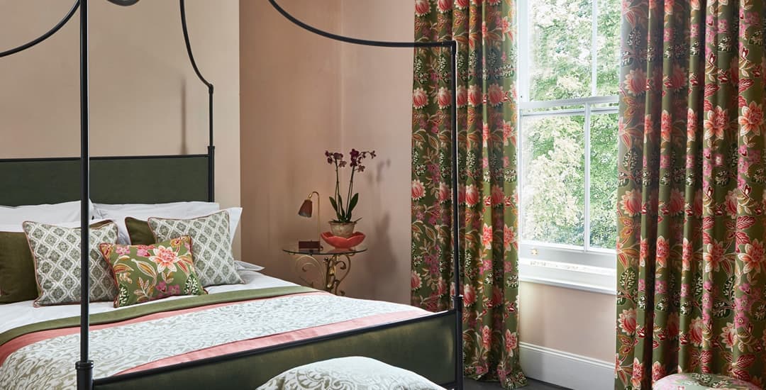 Luxury green and red floral curtains in traditional bedroom