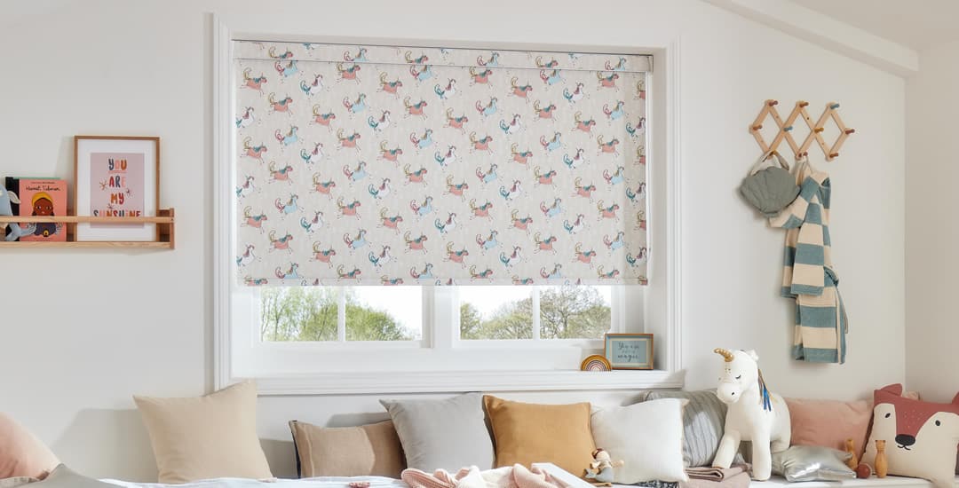 Unicorn patterned blackout roller blinds in a nursery