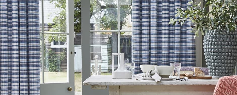Blue and white striped curtains in kitchen diner